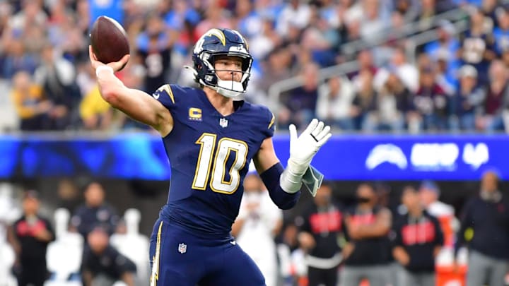 Dec 27, 2025; Inglewood, California, USA;  Los Angeles Chargers quarterback Justin Herbert (10) throws a touchdown pass against the Houston Texans during the second half at SoFi Stadium.