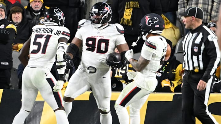 Jan 12, 2026; Pittsburgh, PA, USA; Houston Texans defensive tackle Sheldon Rankins (90) celebrates with Houston Texans defensive end Will Anderson Jr. (51) and safety Jalen Pitre (5) after returning a fumble for a touchdown during the second half of an AFC Wild Card Round game against the Pittsburgh Steelers at Acrisure Stadium. Mandatory Credit: Barry Reeger-Imagn Images