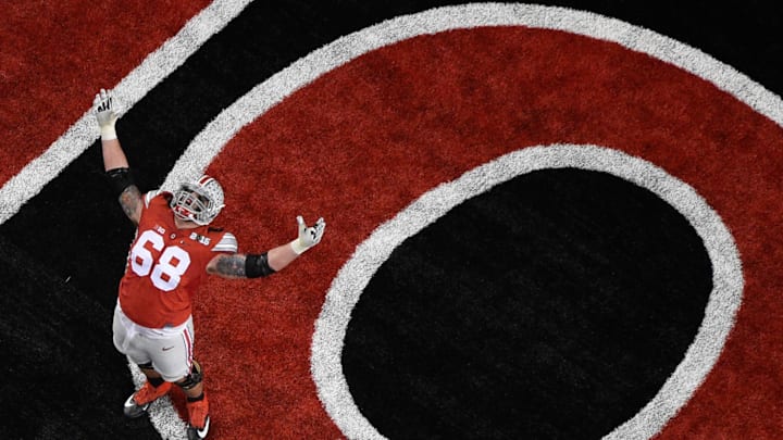 January 12, 2015; Arlington, TX, USA; Ohio State Buckeyes offensive lineman Taylor Decker (68) celebrates after the Buckeyes scored a touchdown during the 2015 CFP National Championship Game against the Oregon Ducks at AT&T Stadium. Mandatory Credit: Kyle Terada-Imagn Images