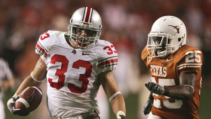 Ohio State's James Laurinaitis, 33, runs out of bounce as Texas Jamaal Charles, 25, gives chase after Laurinaitis intercepted the ball in the second half of their game at Texas Memorial Stadium, September 9, 2006.