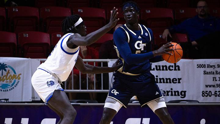 Drake's Okku Federiko (8) defends Georgia Tech's Mouhamed Sylla (6) during the Emerald Coast Classic 3rd-place game at Raider Arena in Niceville, Fla., Nov. 29, 2025. Drake won the game 84-74. (Tyler Orsburn/News Herald)