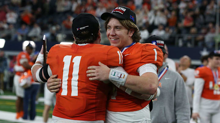 Celina's Luke Biagini (11), the defensive MVP, hugs Bowe Bentley, the offensive MVP, after the Class 4A, Division I State Championship game on Friday, Dec. 20, 2024, at AT&T Stadium in Arlington, Texas.