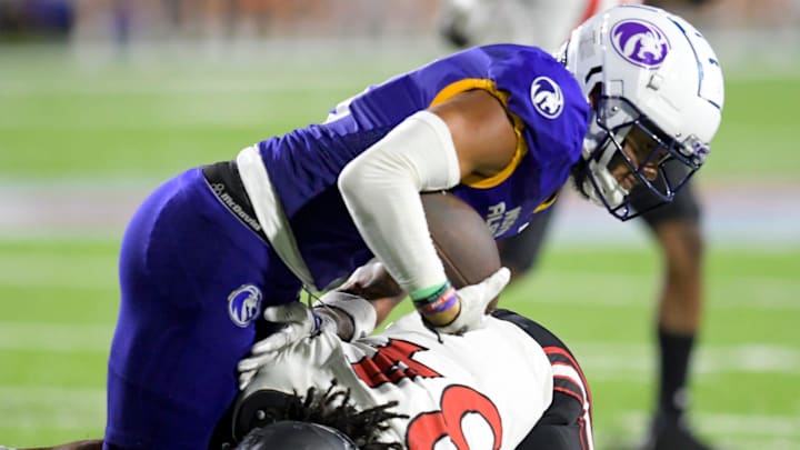 Southeast Missouri State Redhawks defensive back Landon Sylvie (34) stops North Alabama Lions wide receiver Logan Collier (9) during the FCS Kickoff game at Cramton Bowl in Montgomery, Ala., on Saturday August 24, 2024.