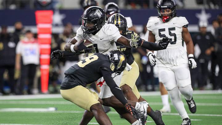 Richmond Randle's Landen Williams-Callis breaks a tackle by South Oak Cliff's Rickey Giles during the Class 5A Division II State Championship game on Friday, Dec. 20, 2024, at AT&T Stadium in Arlington, Texas. Richmond Randle's Landen Williams-Callis breaks a tackle by South Oak Cliff's Rickey Giles during the Class 5A Division II State Championship game on Friday, Dec. 20, 2024, at AT&T Stadium in Arlington, Texas.