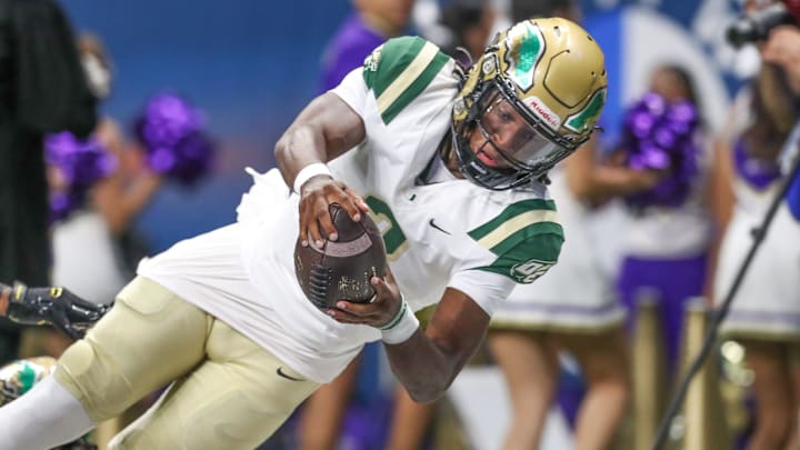 DeSoto's Kelden Ryan reaches for the end zone for a touchdown during Friday's game at the Alamodome on Sept. 13, 2024, in San Antonio, Texas.