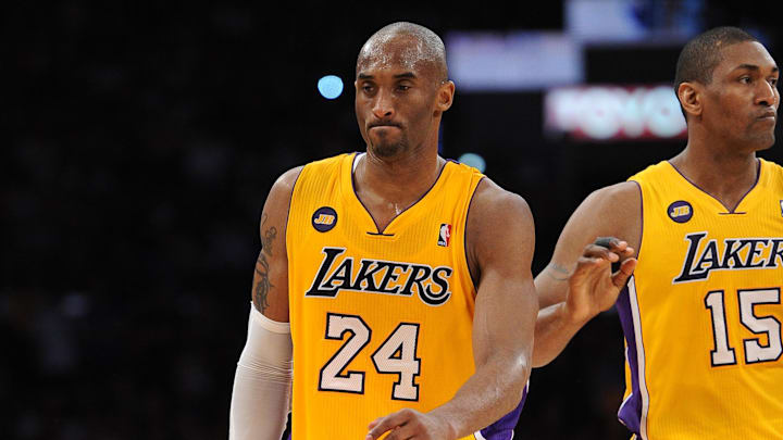 April 12, 2013; Los Angeles, CA, USA;  Los Angeles Lakers small forward Metta World Peace (15) subs for shooting guard Kobe Bryant (24) as leaves the game in the fourth quarter against the Golden State Warriors at the Staples Center. Bryant suffered a torn Achilles tendon. He under went surgery April 13 and is expected to miss six to nine months. Mandatory Credit: Jayne Kamin-Oncea-Imagn Images