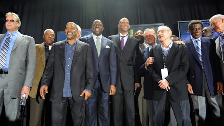 November 16, 2012; Los Angeles, CA, USA;   Former pro basketball players, Kurt Rambis, Dr. J, Norm Nixon, Irvin "Magic" Johnson,  Kareem Abdul-Jabbar James Worthy,  coach Pat Riley, coach Bill Sharman, Elgin Baylor and Jerry West on stage after the ceremony unveiling the Kareem Abdul-Jabbar statue in front of the Staples Center. Mandatory Credit: Jayne Kamin-Oncea-Imagn Images