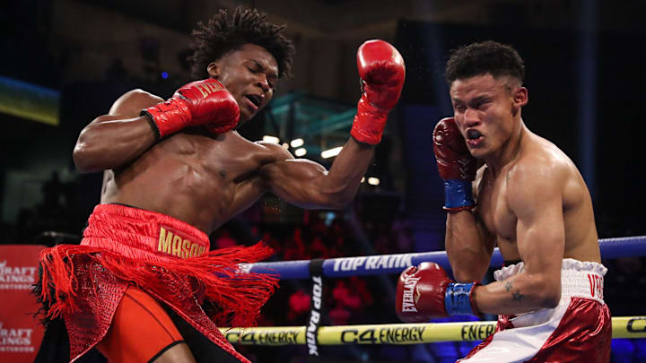 Abdullah Mason lands a left uppercut against Ronal Ron. Abdullah Mason lands a left uppercut against Ronal Ron.