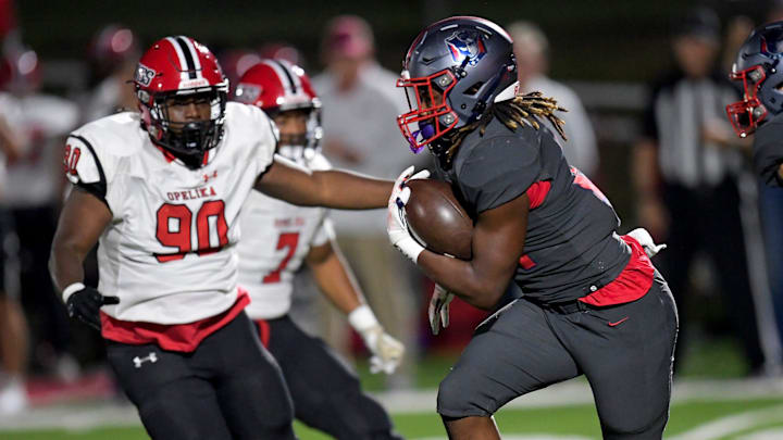 Pike Road's Ja'Michael Jones (21) carries the ball against Opelika during their game on the Pike Road High School campus in Pike Road, Ala., on Friday September 27, 2024.