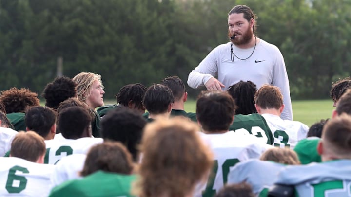Flagler Palm Coast head football coach Daniel Fish talks with the team during practice, Thursday morning, Aug. 8, 2024.