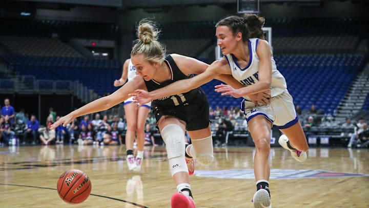 Farwell's Isabella Jaime, right, and Martin's Mill's Teely Salazar chase a loose ball during the Class 2A Division II state championship girls basketball game on Thursday, February. 27, 2025, at the Alamodome in San Antonio.