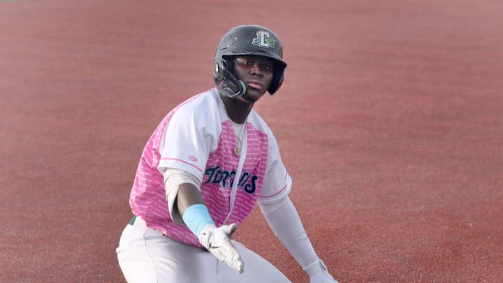 Daytona Tortugas Hector Rodriguez  #25 gestures to his team mates in the dugout after sliding into thrid on a triple against Palm Beach Cardinals, Tuesday June 20, 2023 at Jackie Robinson Ballpark.
