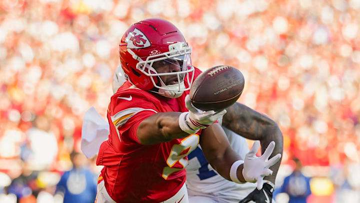 Nov 23, 2025; Kansas City, Missouri, USA; Kansas City Chiefs wide receiver JuJu Smith-Schuster (9) is unable to make the catch against Indianapolis Colts cornerback Charvarius Ward (7) during the second half at GEHA Field at Arrowhead Stadium. Mandatory Credit: Jay Biggerstaff-Imagn Images