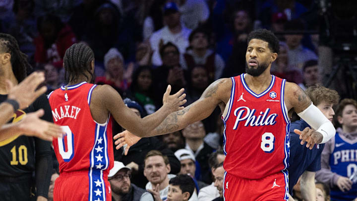 Jan 24, 2025; Philadelphia, Pennsylvania, USA; Philadelphia 76ers forward Paul George (8) high fives guard Tyrese Maxey (0) after scoring during the fourth quarter against the Cleveland Cavaliers at Wells Fargo Center. Mandatory Credit: Bill Streicher-Imagn Images