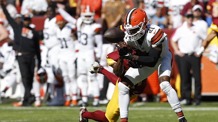 Oct 6, 2024; Landover, Maryland, USA; Cleveland Browns cornerback Denzel Ward (21) breaks up a pass intended for Washington Commanders wide receiver Terry McLaurin (17) during the second quarter at NorthWest Stadium. Mandatory Credit: Geoff Burke-Imagn Images