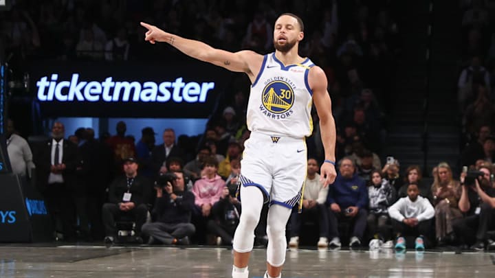 Golden State Warriors guard Curry gestures after making a three-point shot in the first quarter against the Brooklyn Nets at Barclays Center. 