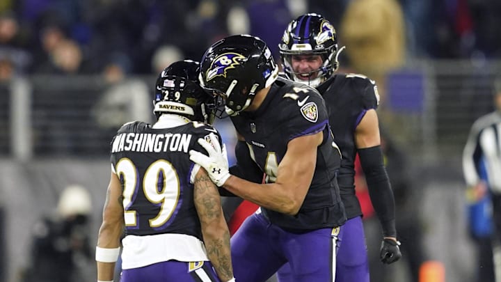 Dec 21, 2025; Baltimore, Maryland, USA; Baltimore Ravens safety Ar'Darius Washington (29) celebrates recovering a New England Patriots fumble with safety Kyle Hamilton (14) during the first half of the game at M&T Bank Stadium. Mandatory Credit: Mitch Stringer-Imagn Images Dec 21, 2025; Baltimore, Maryland, USA; Baltimore Ravens safety Ar'Darius Washington (29) celebrates recovering a New England Patriots fumble with safety Kyle Hamilton (14) during the first half of the game at M&T Bank Stadium. Mandatory Credit: Mitch Stringer-Imagn Images