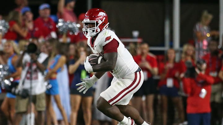 Sep 13, 2025; Oxford, Mississippi, USA; Arkansas Razorback running back Braylen Russell (0) runs the ball  during the fourth quarter against the Mississippi Rebels at Vaught-Hemingway Stadium. Mandatory Credit: Petre Thomas-Imagn Images