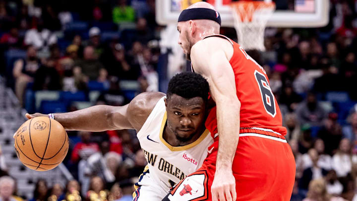 New Orleans Pelicans forward Zion Williamson (1) dribbles against Chicago Bulls guard Alex Caruso (6) during the first half at Smoothie King Center. Mandatory Credit: Stephen Lew-Imagn Images
