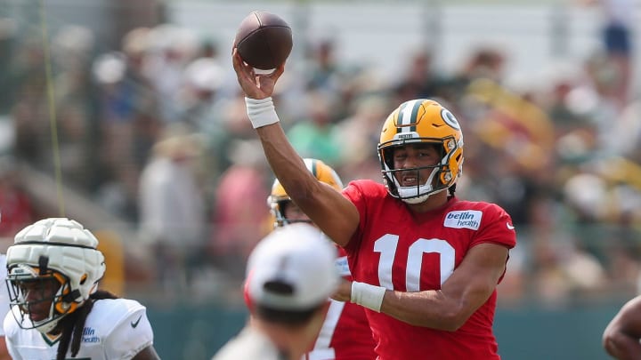 Green Bay Packers QB Jordan Love passes the ball at training camp. Green Bay Packers QB Jordan Love passes the ball at training camp.