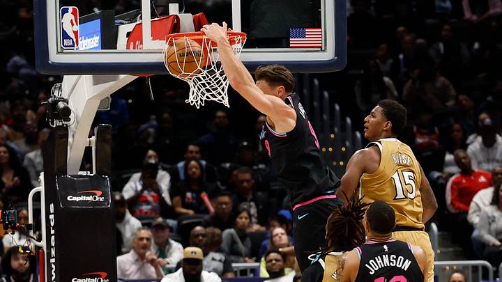 Apr 10, 2026; Washington, District of Columbia, USA; Miami Heat guard Pelle Larsson (9) dunks the ball and Washington Wizards forward Julian Reese (15) defends in the second half at Capital One Arena. Mandatory Credit: Geoff Burke-Imagn Images Apr 10, 2026; Washington, District of Columbia, USA; Miami Heat guard Pelle Larsson (9) dunks the ball and Washington Wizards forward Julian Reese (15) defends in the second half at Capital One Arena. Mandatory Credit: Geoff Burke-Imagn Images