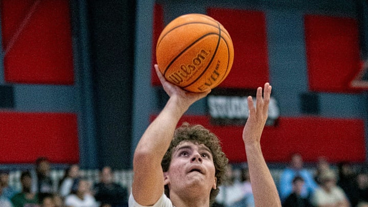 Victory Christian's Tucker Fox goes up for a shot against City of Life Christian on Saturday night in the championship game of the Class 1A, District 9 boys basketball tournament. Victory Christian's Tucker Fox goes up for a shot against City of Life Christian on Saturday night in the championship game of the Class 1A, District 9 boys basketball tournament.
