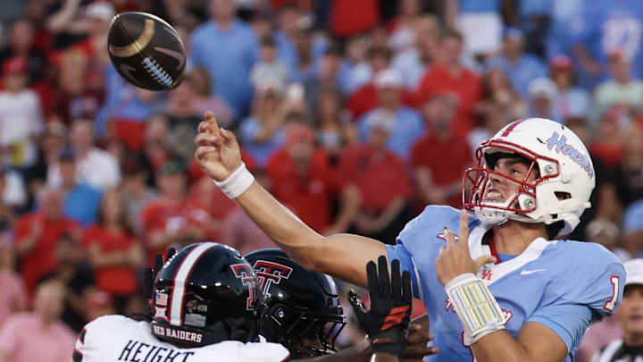 Oct 4, 2025; Houston, Texas, USA; Houston Cougars quarterback Conner Weigman (1) passes while being rushed by Texas Tech Red Raiders defensive end Romello Height (9) in the first half at TDECU Stadium. Mandatory Credit: Thomas Shea-Imagn Images Oct 4, 2025; Houston, Texas, USA; Houston Cougars quarterback Conner Weigman (1) passes while being rushed by Texas Tech Red Raiders defensive end Romello Height (9) in the first half at TDECU Stadium. Mandatory Credit: Thomas Shea-Imagn Images