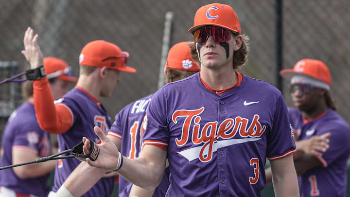Clemson outfielder Ty Dalley (3) stretches before the game with Army West Point at Doug Kingsmore Stadium in Clemson, S.C. Saturday, Feb 14, 2026.