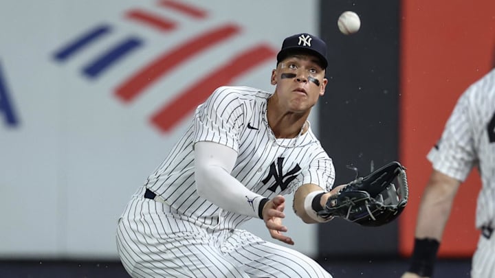 Jul 9, 2025; Bronx, New York, USA;  New York Yankees right fielder Aaron Judge (99) makes a running catch in the eighth inning against the Seattle Mariners at Yankee Stadium. Mandatory Credit: Wendell Cruz-Imagn Images