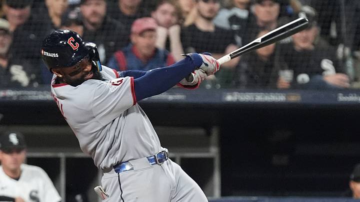 Oct 8, 2026; Chicago, Illinois, USA; Cleveland Guardians designated hitter Jo Adell (7) hits an RBI single during the sixth inning against the Chicago White Sox in game four of the ALDS for the 2026 MLB Playoffs at Rate Field. Mandatory Credit: David Banks-Imagn Images Oct 8, 2026; Chicago, Illinois, USA; Cleveland Guardians designated hitter Jo Adell (7) hits an RBI single during the sixth inning against the Chicago White Sox in game four of the ALDS for the 2026 MLB Playoffs at Rate Field. Mandatory Credit: David Banks-Imagn Images