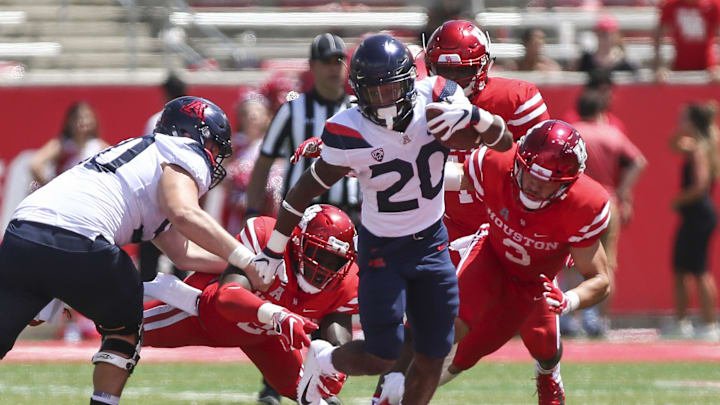 Sep 8, 2018; Houston, TX, USA; Arizona Wildcats running back Darrius Smith (20) runs with the ball during the fourth quarter against the Houston Cougars at TDECU Stadium. Mandatory Credit: Troy Taormina-Imagn Images