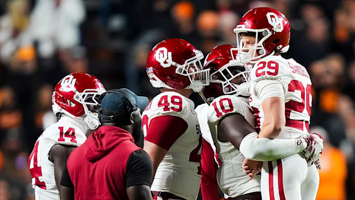 Oklahoma players celebrate with kicker Tate Sandell at Tennessee. Oklahoma players celebrate with kicker Tate Sandell at Tennessee.