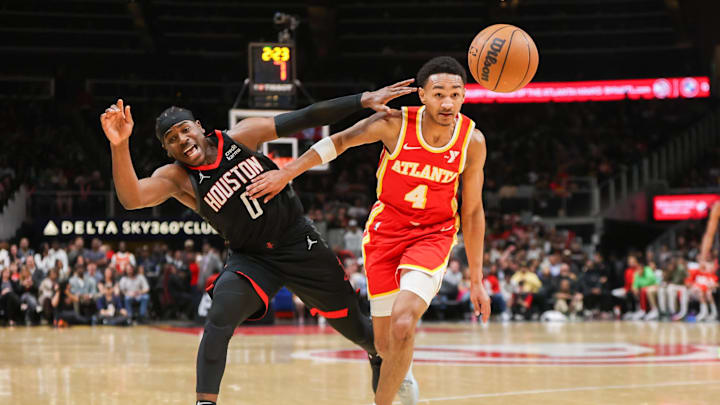 Feb 10, 2024; Atlanta, Georgia, USA; Houston Rockets guard Aaron Holiday (0) is fouled by Atlanta Hawks guard Kobe Bufkin (4) in the second half at State Farm Arena. Mandatory Credit: Brett Davis-Imagn Images Feb 10, 2024; Atlanta, Georgia, USA; Houston Rockets guard Aaron Holiday (0) is fouled by Atlanta Hawks guard Kobe Bufkin (4) in the second half at State Farm Arena. Mandatory Credit: Brett Davis-Imagn Images