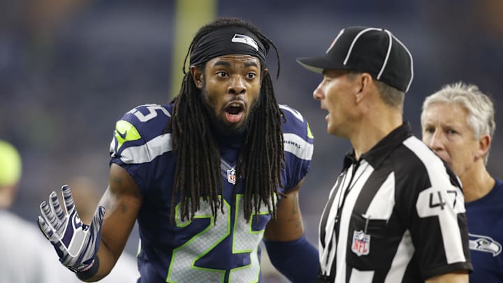 Nov 1, 2015; Arlington, TX, USA; Seattle Seahawks cornerback Richard Sherman (25) talks to line judge Tim Podraza (47) in the fourth quarter against the Dallas Cowboys at AT&T Stadium. Seattle won 13-12. 