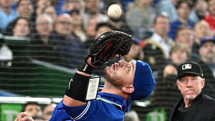 Apr 29, 2022; Toronto, Ontario, CAN;   Toronto Blue Jays catcher Alejandro Kirk (30) catches a pop foul hit by Houston Astros first baseman Yuli Gurriel (not shown) as home plate umpire Lance Barksdale looks on in the eighth inning at Rogers Centre. Mandatory Credit: Dan Hamilton-Imagn Images
