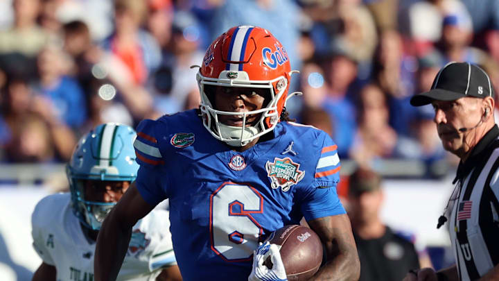 Dec 20, 2024; Tampa, FL, USA; Florida Gators wide receiver Elijhah Badger (6) runs with the ball against the Tulane Green Wave during the first quarter at Raymond James Stadium. Mandatory Credit: Kim Klement Neitzel-Imagn Images