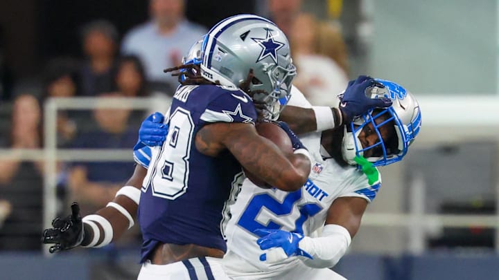 Dallas Cowboys wide receiver CeeDee Lamb stiff-arms Detroit Lions cornerback Amik Robertson at AT&T Stadium