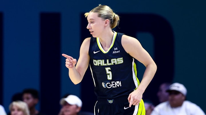 Jul 30, 2025; Arlington, Texas, USA;  Dallas Wings guard Paige Bueckers (5) reacts against the Atlanta Dream during the first half at College Park Center. Mandatory Credit: Kevin Jairaj-Imagn Images
