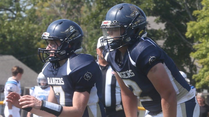 Traip Academy quarterback Max Jordan, left, and running back Seamus Berry were both instrumental in the running game in Saturday's 32-8 win over Telstar in 8-Man Small South football at Memorial Field in Kittery, Maine.