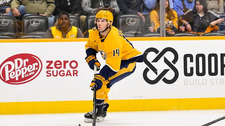 Oct 13, 2026; Nashville, Tennessee, USA; Nashville Predators center Alexander Kerfoot (14) skates with the puck against the Vegas Golden Knights during the first period at Bridgestone Arena. Mandatory Credit: Steve Roberts-Imagn Images Oct 13, 2026; Nashville, Tennessee, USA; Nashville Predators center Alexander Kerfoot (14) skates with the puck against the Vegas Golden Knights during the first period at Bridgestone Arena. Mandatory Credit: Steve Roberts-Imagn Images