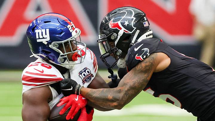 Aug 17, 2024; Houston, Texas, USA; New York Giants running back Devin Singletary (26) is tackled by Houston Texans safety Jalen Pitre (5) in the first quarter at NRG Stadium. Mandatory Credit: Thomas Shea-USA TODAY Sports Aug 17, 2024; Houston, Texas, USA; New York Giants running back Devin Singletary (26) is tackled by Houston Texans safety Jalen Pitre (5) in the first quarter at NRG Stadium. Mandatory Credit: Thomas Shea-USA TODAY Sports