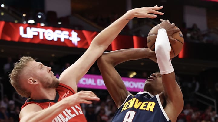 Apr 13, 2025; Houston, Texas, USA; Denver Nuggets forward Peyton Watson (8) shoots against Houston Rockets center Jock Landale (2) in the second half at Toyota Center. Mandatory Credit: Thomas Shea-Imagn Images