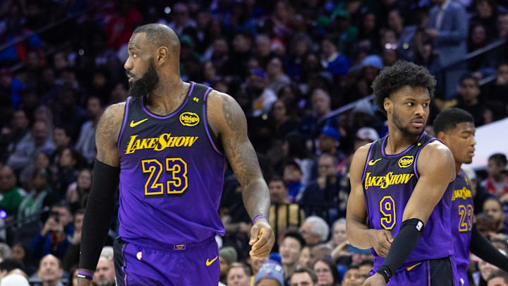 Jan 28, 2025; Philadelphia, Pennsylvania, USA; Los Angeles Lakers forward LeBron James (23) and guard Bronny James (9) look on during the third quarter against the Philadelphia 76ers at Wells Fargo Center. Mandatory Credit: Bill Streicher-Imagn Images Jan 28, 2025; Philadelphia, Pennsylvania, USA; Los Angeles Lakers forward LeBron James (23) and guard Bronny James (9) look on during the third quarter against the Philadelphia 76ers at Wells Fargo Center. Mandatory Credit: Bill Streicher-Imagn Images