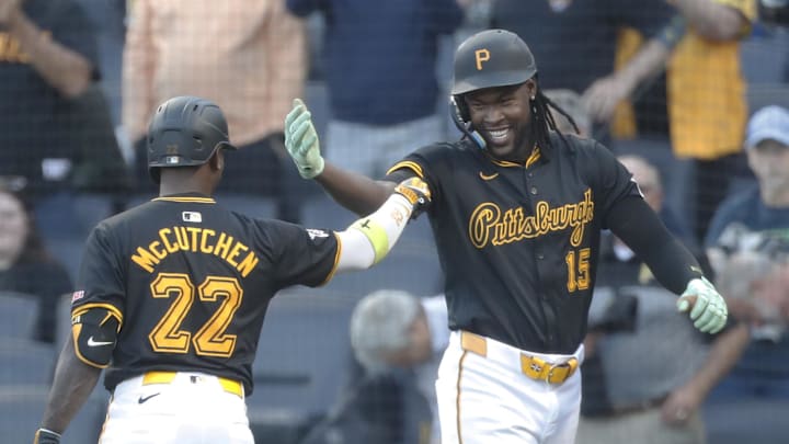 Sep 9, 2024; Pittsburgh, Pennsylvania, USA;  Pittsburgh Pirates center fielder Oneil Cruz (15) celebrates his solo home run with designated hitter Andrew McCutchen (22) against the Miami Marlins during the first inning at PNC Park. Mandatory Credit: Charles LeClaire-Imagn Images