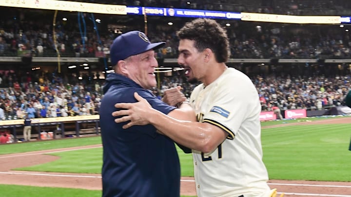 Sep 18, 2024; Milwaukee, Wisconsin, USA;  Milwaukee Brewers manager Pat Murphy and shortstop Willy Adames (27) celebrate after beating the Philadelphia Phillies and winning the NL Central Division at American Family Field. Mandatory Credit: Benny Sieu-Imagn Images