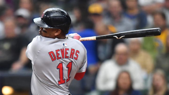 Boston Red Sox designated hitter Rafael Devers (11) hits a two run single during the fourth inning against the Milwaukee Brewers at American Family Field on May 28. Boston Red Sox designated hitter Rafael Devers (11) hits a two run single during the fourth inning against the Milwaukee Brewers at American Family Field on May 28.