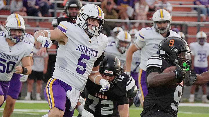 Ames’ running back Eli Cosby (9) runs with the ball around Johnston's defender Max Mincks (5)during the first quarter at Ames High Football field o, Sept 12, 2025, in Ames, Iowa Ames’ running back Eli Cosby (9) runs with the ball around Johnston's defender Max Mincks (5)during the first quarter at Ames High Football field o, Sept 12, 2025, in Ames, Iowa