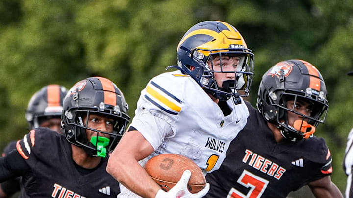 Clarkston running back Lucas Bowman (1) runs for a touchdown against Belleville during the second half of Prep Kickoff Classic at Wayne State University' Adams Field in Detroit on Thursday, August 28, 2025.