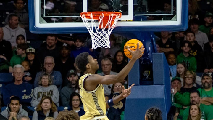 Feb 14, 2026; South Bend, Indiana, USA; Georgia Tech Yellow Jackets forward Kowacie Reeves Jr. (14) drives to the basket against the Notre Dame Fighting Irish during the first half at Purcell Pavilion at the Joyce Center. Mandatory Credit: Michael Caterina-Imagn Images