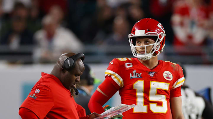 Feb 2, 2020; Miami Gardens, Florida, USA; Kansas City Chiefs quarterback Patrick Mahomes (15) with offensive coordinator Eric Bieniemy during a timeout from the game against the San Francisco 49ers in Super Bowl LIV at Hard Rock Stadium. Mandatory Credit: Matthew Emmons-Imagn Images